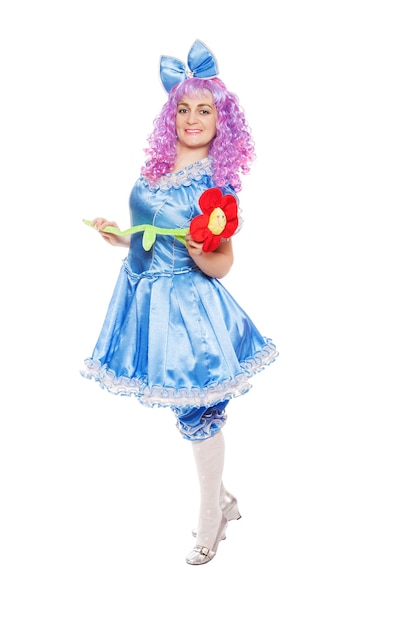 Pretty girl in the dressed like Malvina, doll with the blue hair isolated on the white background