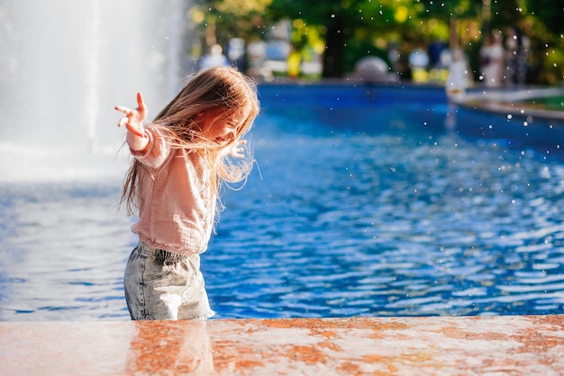 pretty girl having fun in the pool