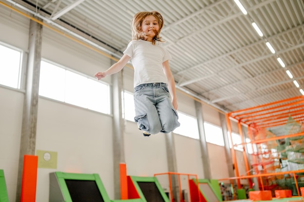 Pretty girl in trampoline park having fun