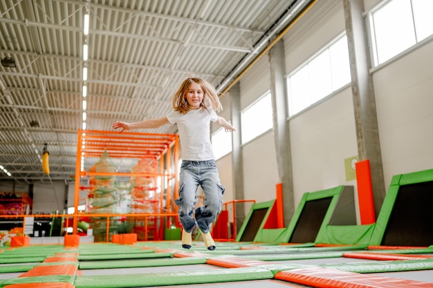 Pretty girl in trampoline park having fun