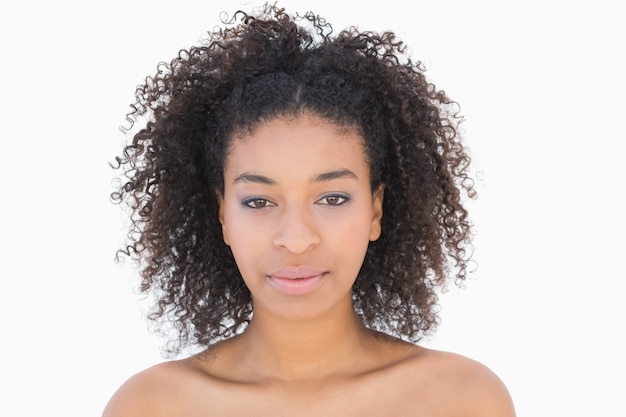 Pretty girl with afro hairstyle smiling at camera