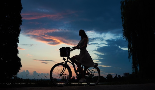 Pretty girl with a blue bike