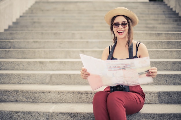 Pretty girl with a map