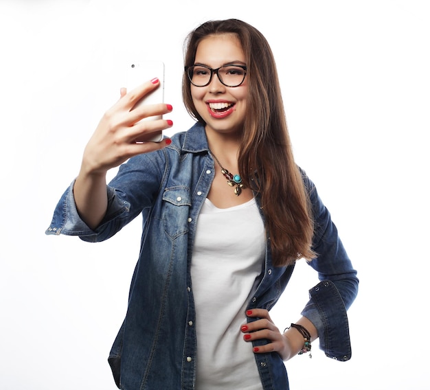 Pretty hipster girl taking selfie Young and happy Lifestyle concept