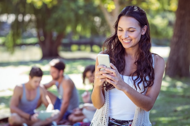 Pretty hipster using her smartphone