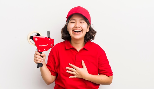 Pretty hispanic girl laughing out loud at some hilarious joke packer concept