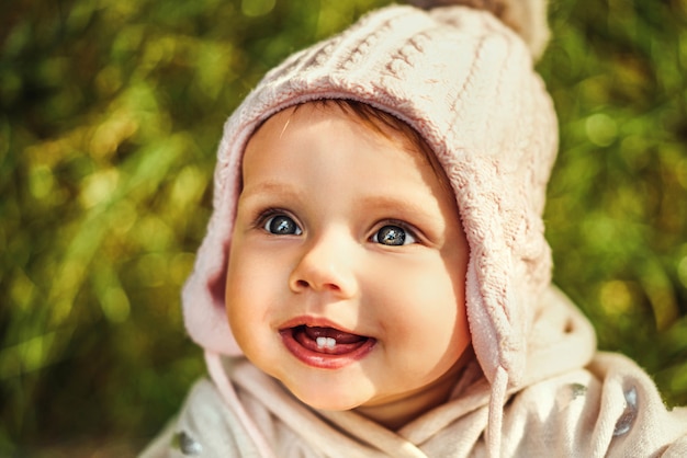 Pretty little baby girl playing outdoor