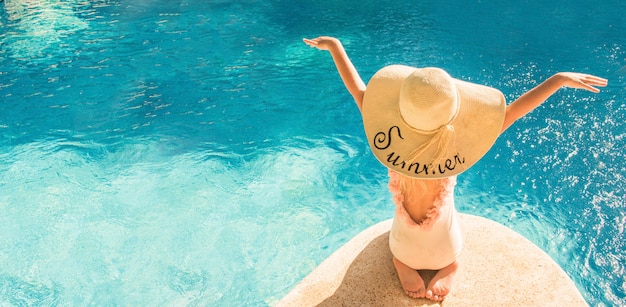 Pretty little girl in swimming pool