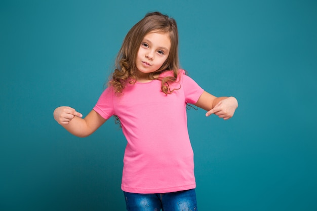 Pretty, little girl in tee shirt with brown hair 