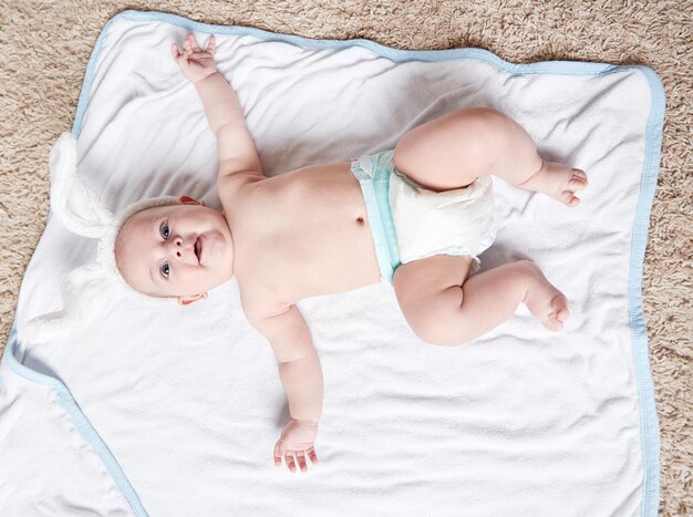 Pretty newborn boy in a rabbit costume