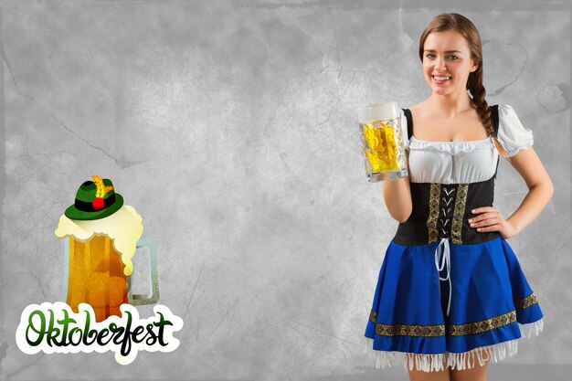 Photo pretty oktoberfest girl smiling at camera holding beer against oktoberfest graphics