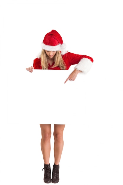 Pretty santa girl holding poster