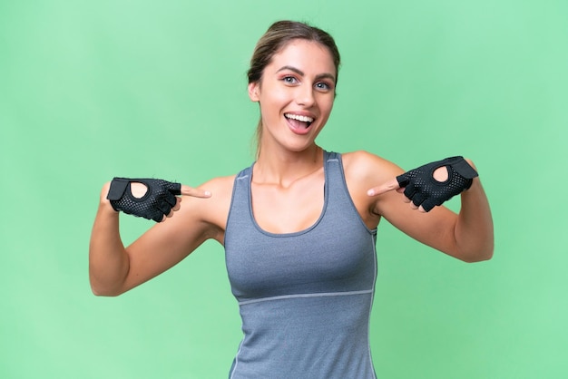 Pretty Sport Uruguayan woman over isolated background proud and selfsatisfied