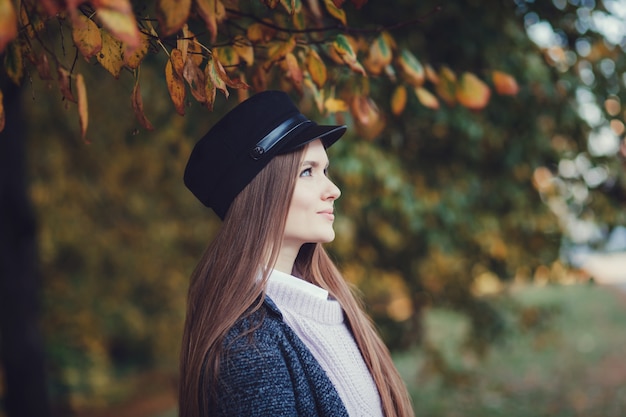 Pretty woman in autumn day