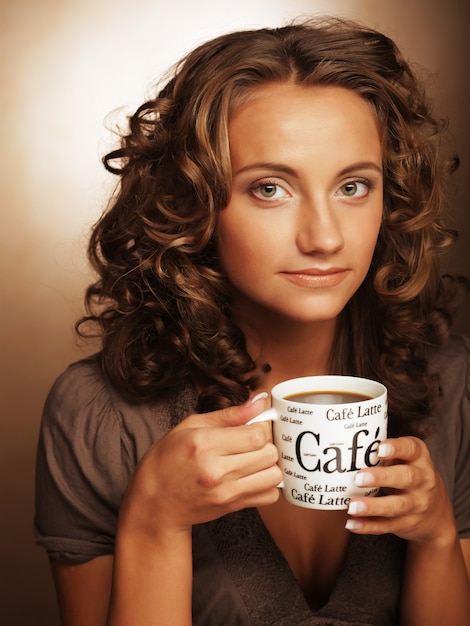 Pretty woman drinking coffee