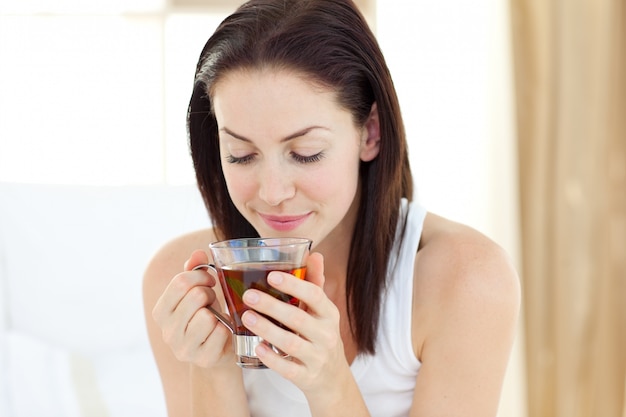 Pretty woman drinking tea