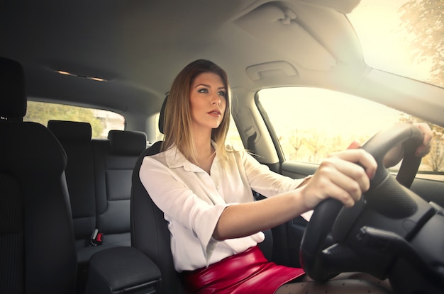 Pretty woman driving a car