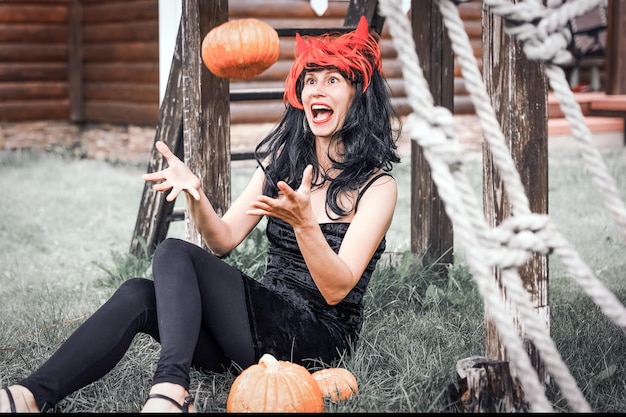 Pretty woman in witch costume at halloween party