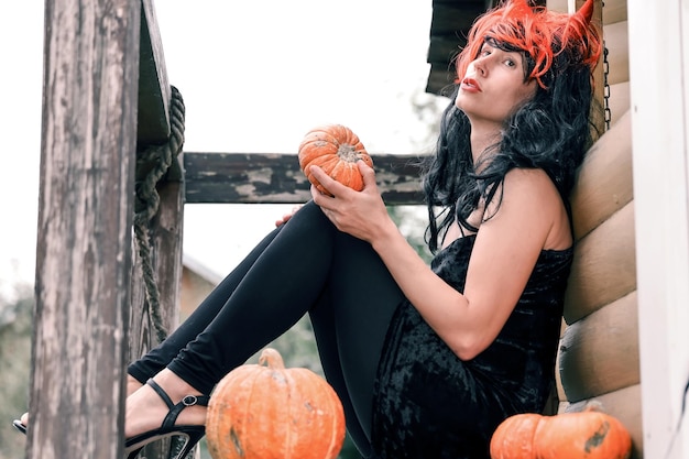 Pretty woman in witch costume at halloween party