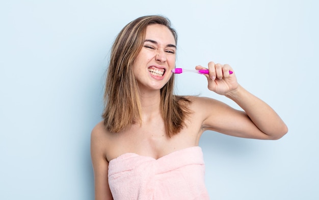 Pretty woman with a toothbrush.