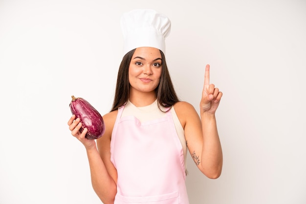 Pretty young adult woman chef and ingredients healthy food concept