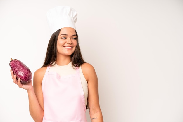 Pretty young adult woman chef and ingredients healthy food concept