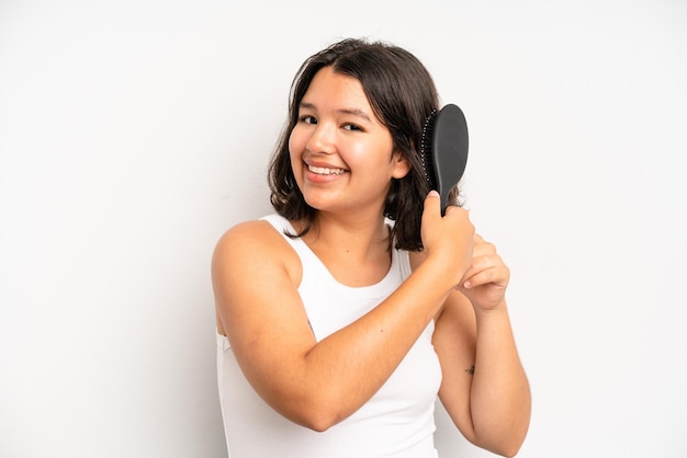 Pretty young adult woman hair comb concept