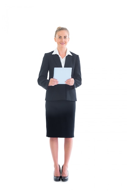 Pretty young businesswoman holding her tablet