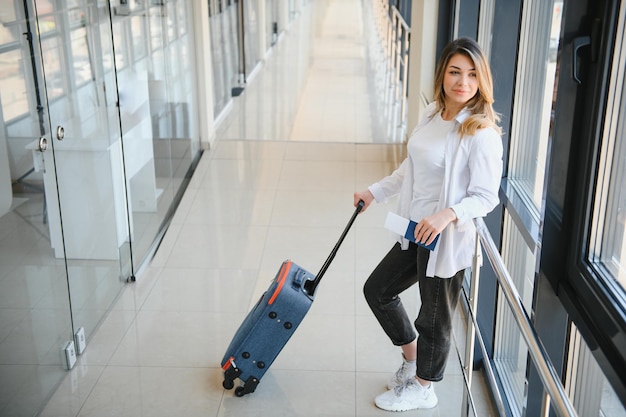 Pretty young female passenger at the airport