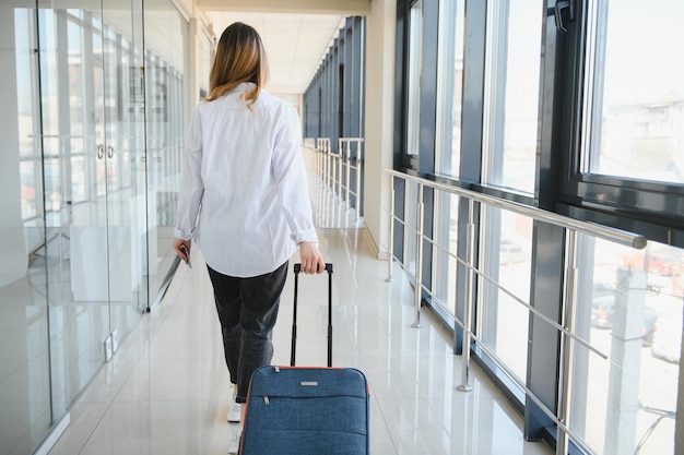 Pretty young female passenger at the airport