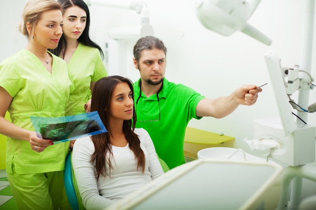 Pretty young girl at a reception in the dental office