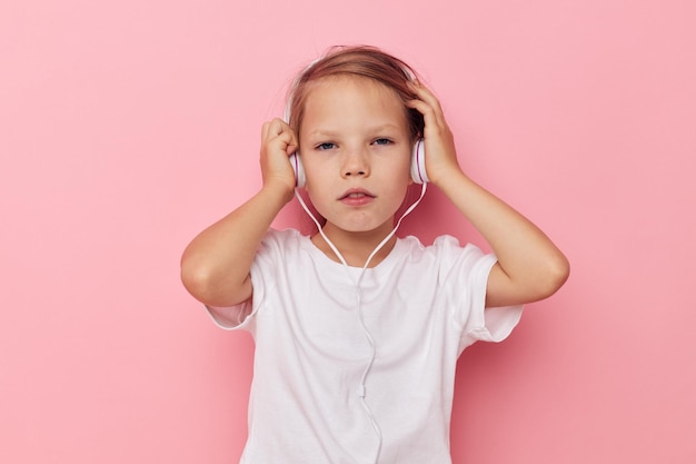 Pretty young girl smile posing headphones isolated background