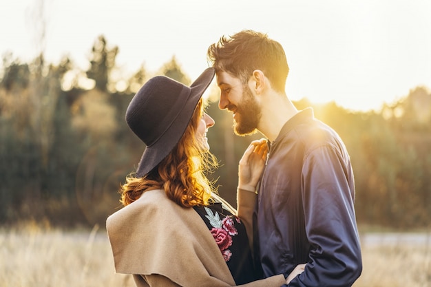 Pretty young romantic couple spend time together outdoor.