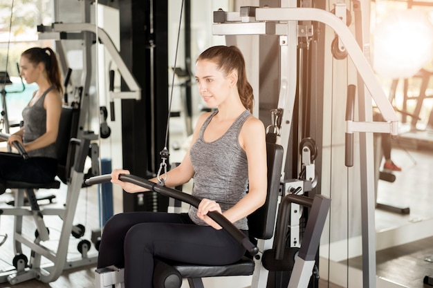 Pretty young sport woman is Workout in gym, Healthy lifestyle 