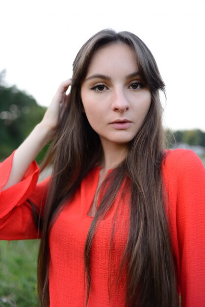 Pretty young woman portrait in red clothes