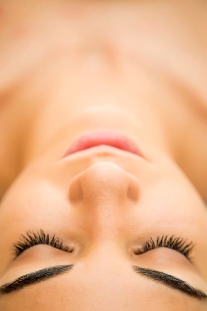 Pretty young woman relaxing in the spa