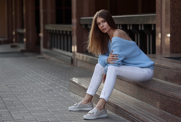 Pretty young woman wearing stylish clothes