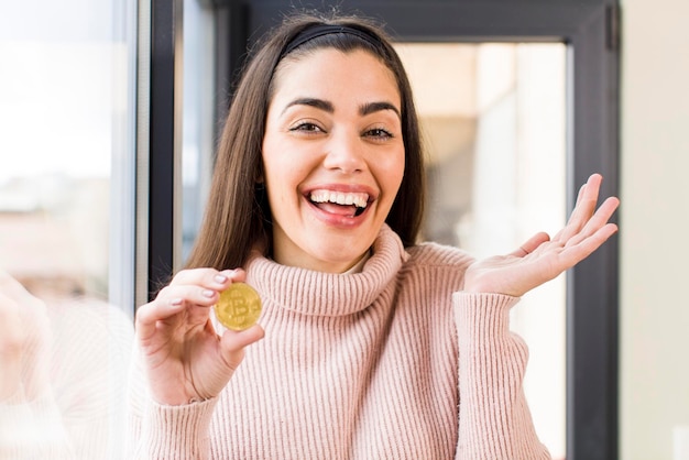 Pretty young woman wholding a bitcoin house interior design