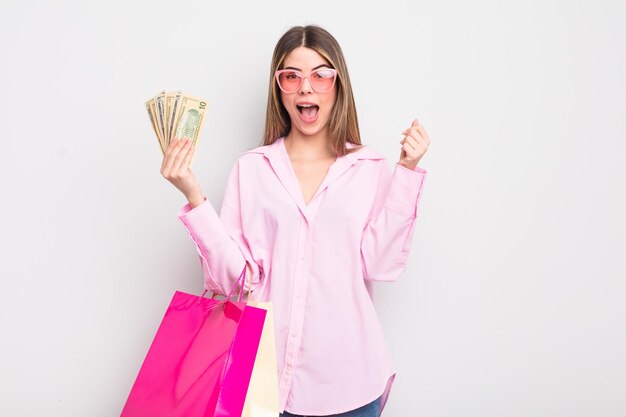 Pretty young woman with shopping bags