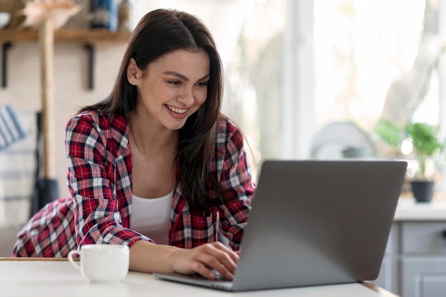 Pretty young woman working on laptop