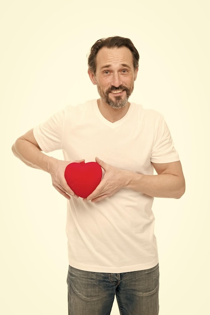 Preventing heart attack Valentines man holding red toy heart in hands Handsome mature man with valentines day heart Heart problem and healthcare Maybe this heartache will be good for him