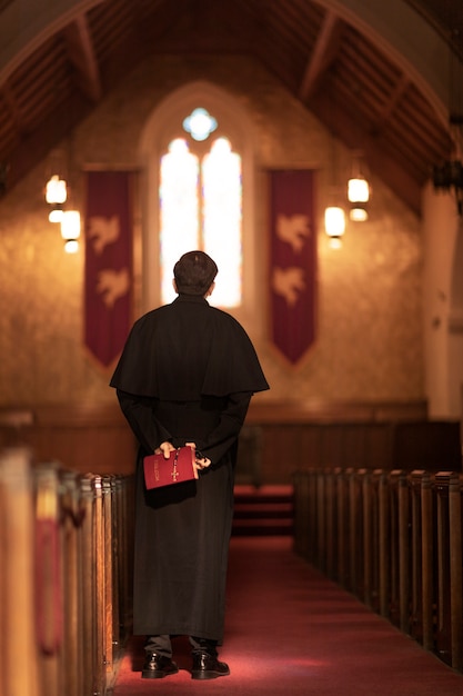 Priest reading from bible