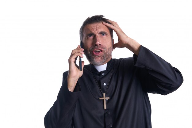 Priest talking smartphone funny expression