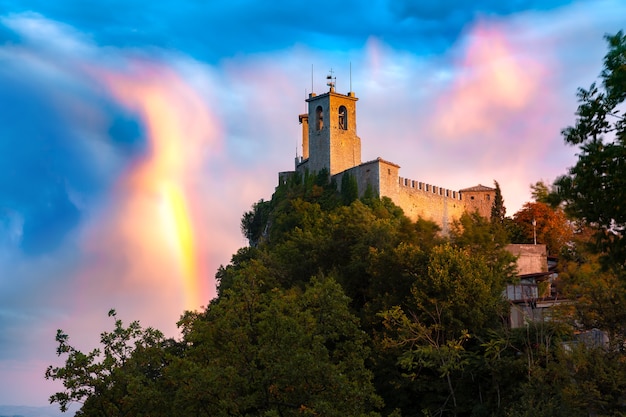 Prima Torre, Guaita fortress, on Mount Titano, in the city of San Marino of the Republic of San Marino at gorgeous sunset with rainbow