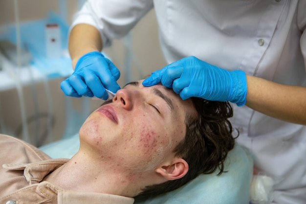 A procedure for mechanical or manual face cleansing by a beautician Professional skin peeling