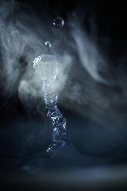 Photo the process of boiling water a stream of water shooting out of a humidifier or diffuser taken in closeup