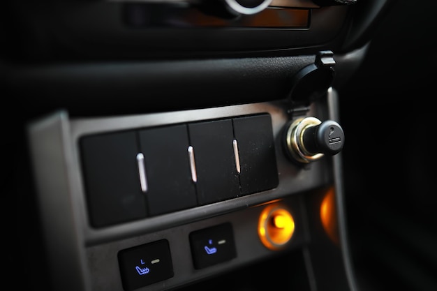 The process of choosing climate control in the car Various controls in auto switches Modern car interior