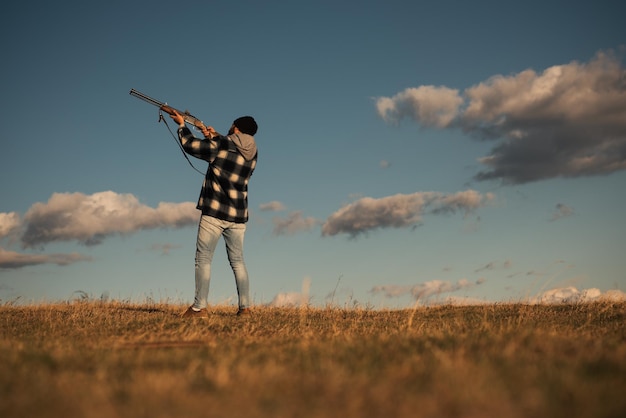 Process of duck hunting Hunter in the fall hunting season Hunter with shotgun gun on hunt Skeet shoo