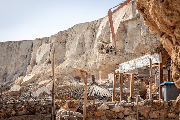 The process of extracting rocks from a cliff in Egypt.