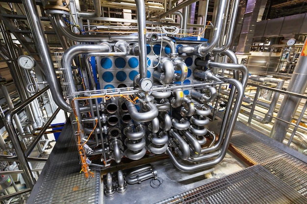 Process heat exchanger at the insulation in process area of pipeline flowing stainless chemical in a factory at control room